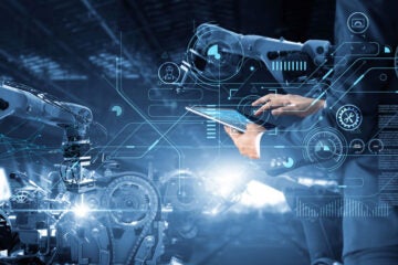 Photo illustration showing manufacturing innovation with interconnected gears and machines